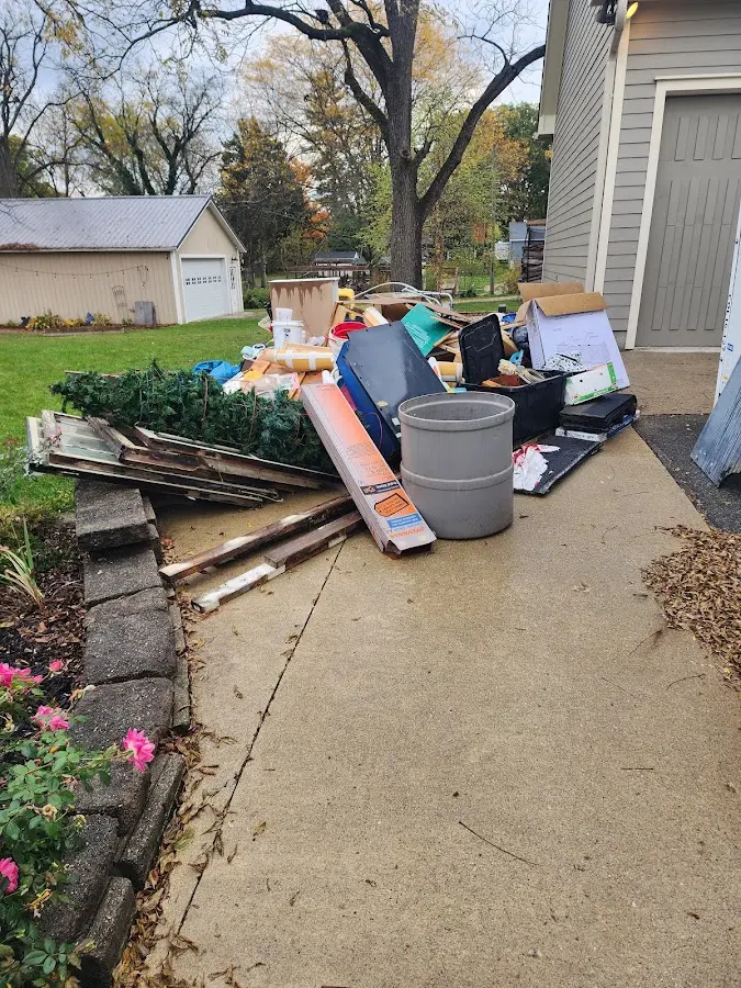 Dumpster being loaded with debris for 12 Yard Dumpster Rental in Dingman